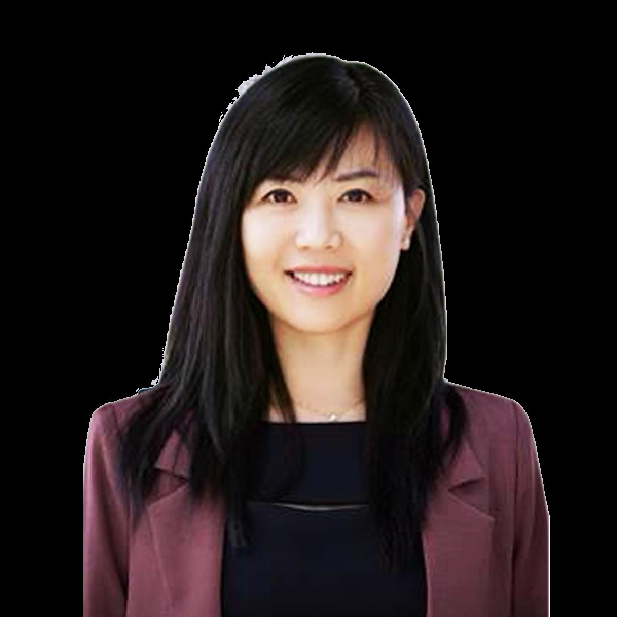 Professional headshot of female healthcare practitioner with dark hair and burgundy blazer