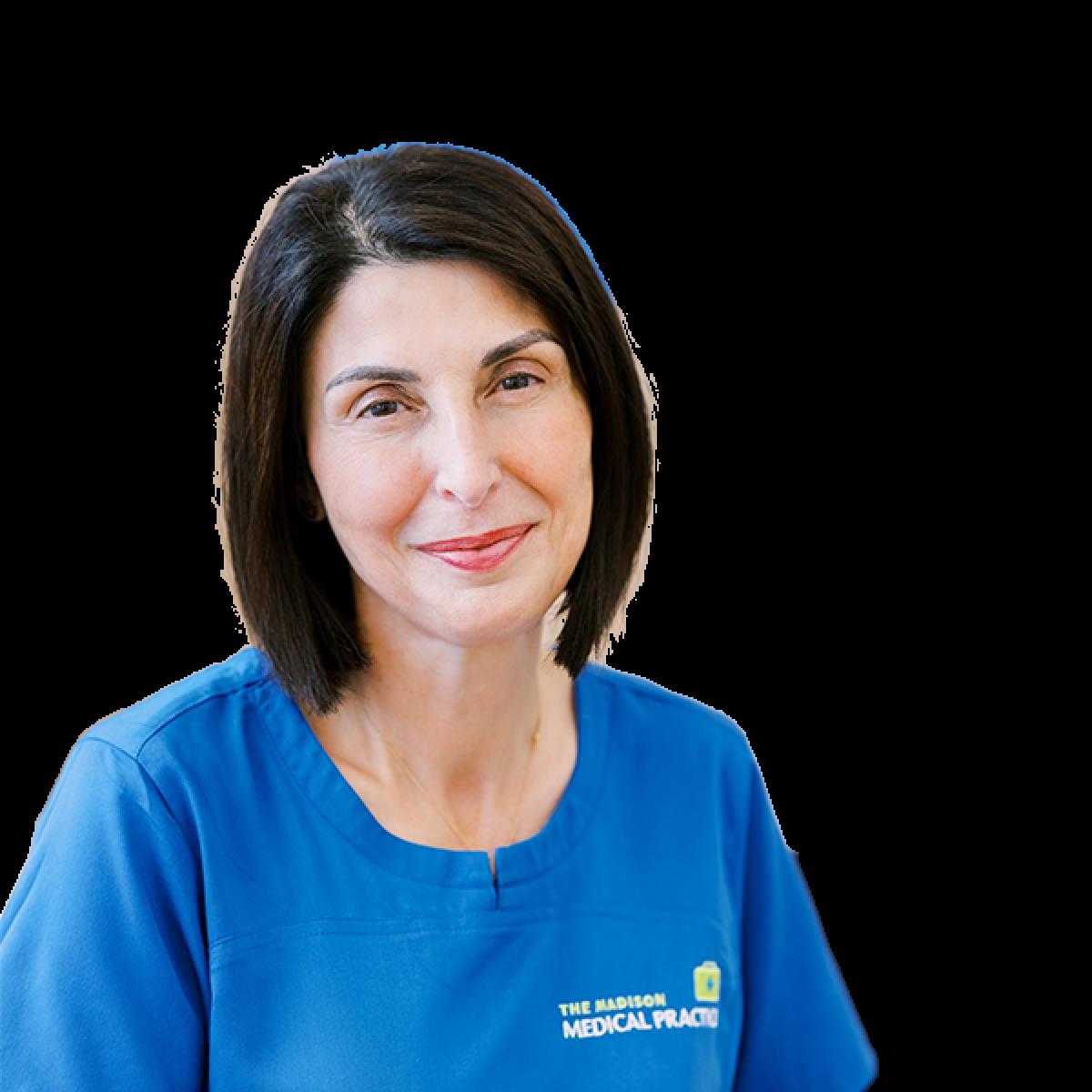 Female healthcare practitioner wearing Madison Medical Practice blue uniform against white background