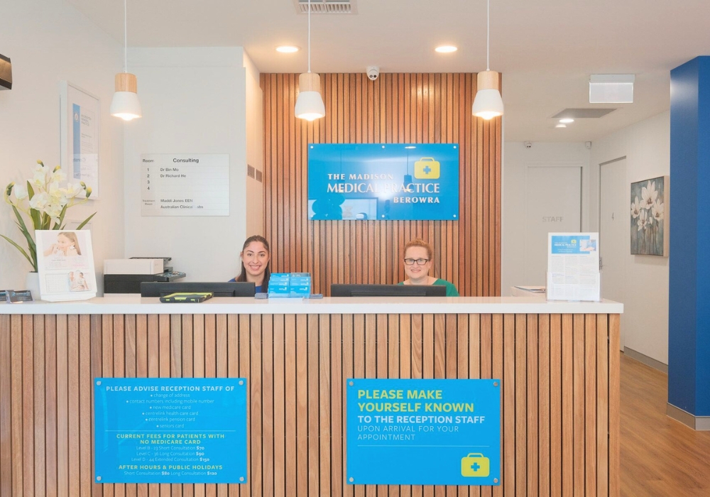 Medical reception desk at The Madison Medical Practice Berowra with two friendly reception staff members ready to assist patients