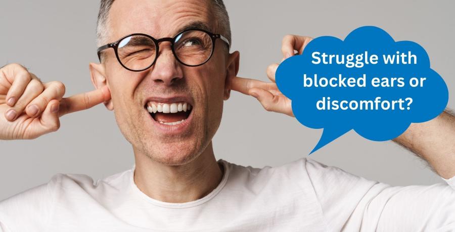 Man with glasses holding his ears in discomfort with text asking about blocked ears or ear discomfort